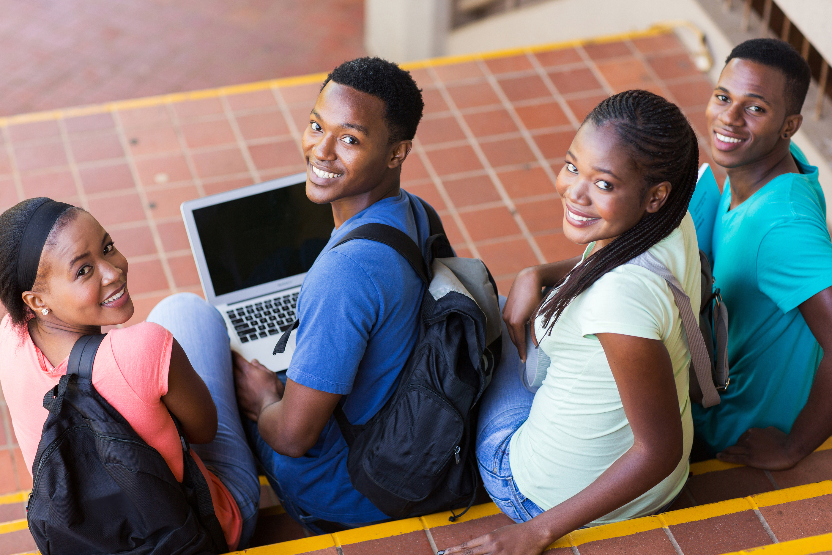 group of happy college students looking back – Forward Together